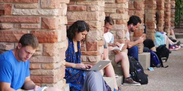 Students sitting outside UMC studying